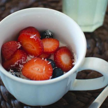 cup of strawberries in a yogurt cup